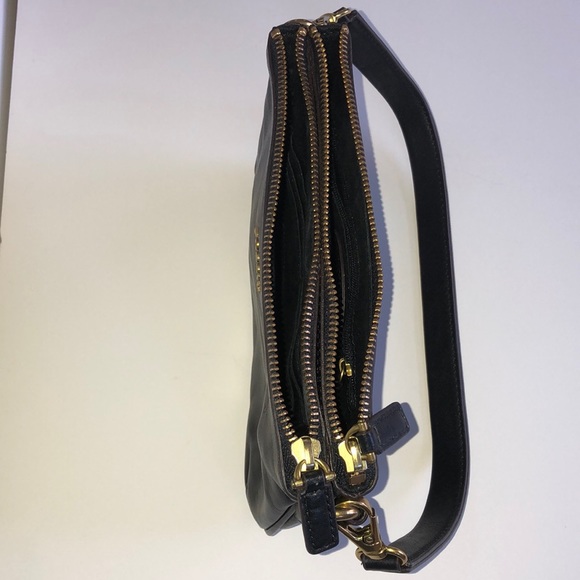 Black leather Fossil handbag with gold accents. - Picture 3 of 3